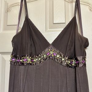 Brown cocktail mini-dress with jewel-tone embellishments on bust and straps.